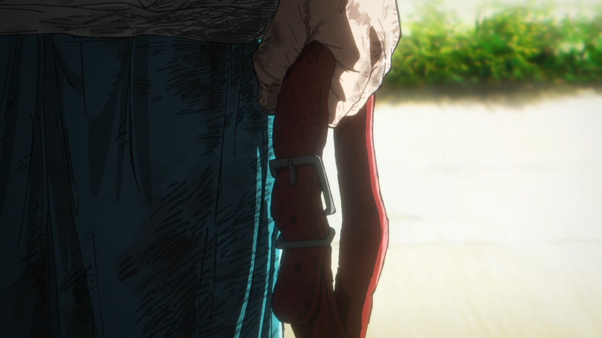 A close up on a dog collar held in Shizuka's battered, bruised hand 